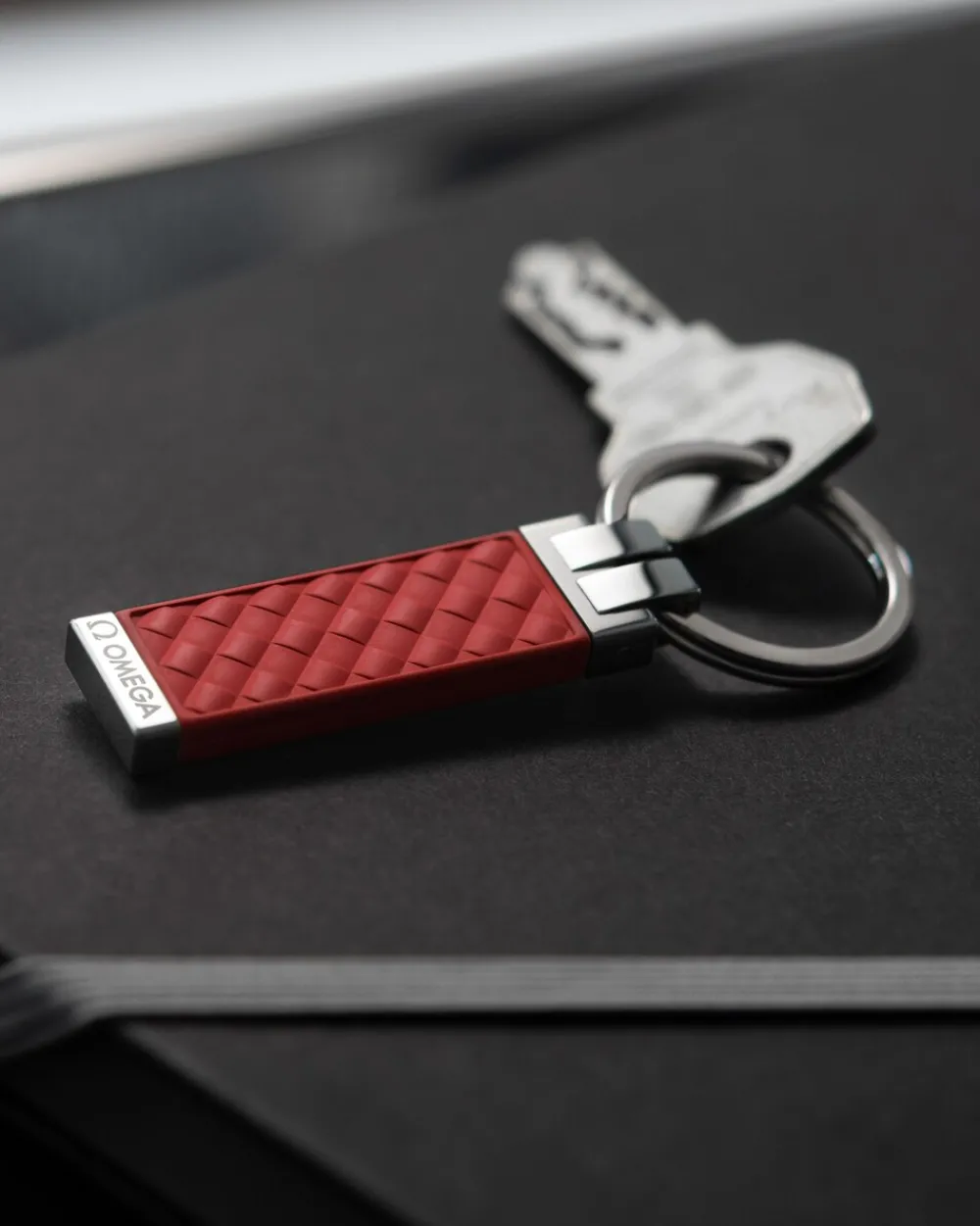 Key holder, rubber, stainless steel^OMEGA Clearance